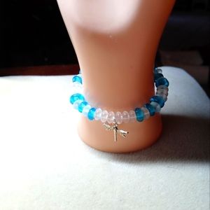 Blue and white stretchy bracelet with charm